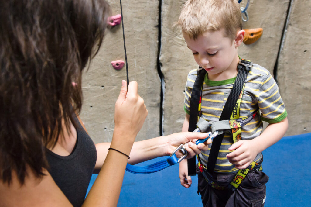 Child getting clipped into TRUBLUE