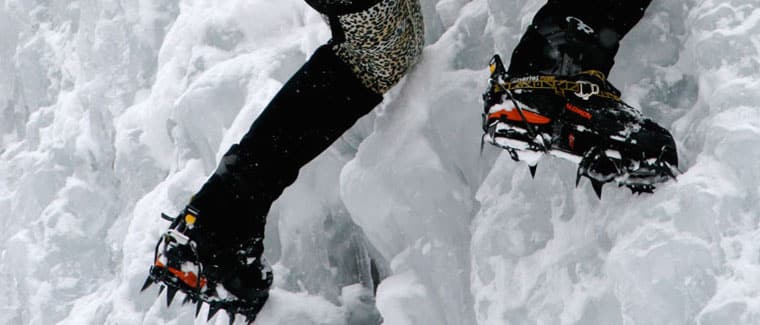 person climbing using crampons