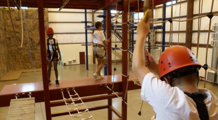 kid at indoor ropes course