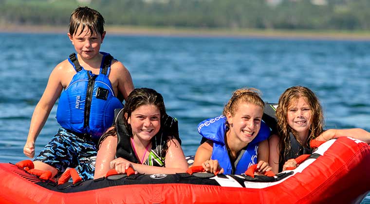 kids at lake tubing