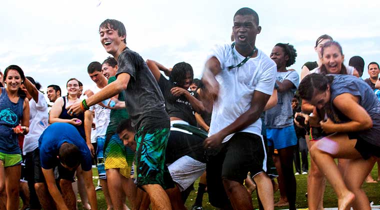 kids having water balloon fight